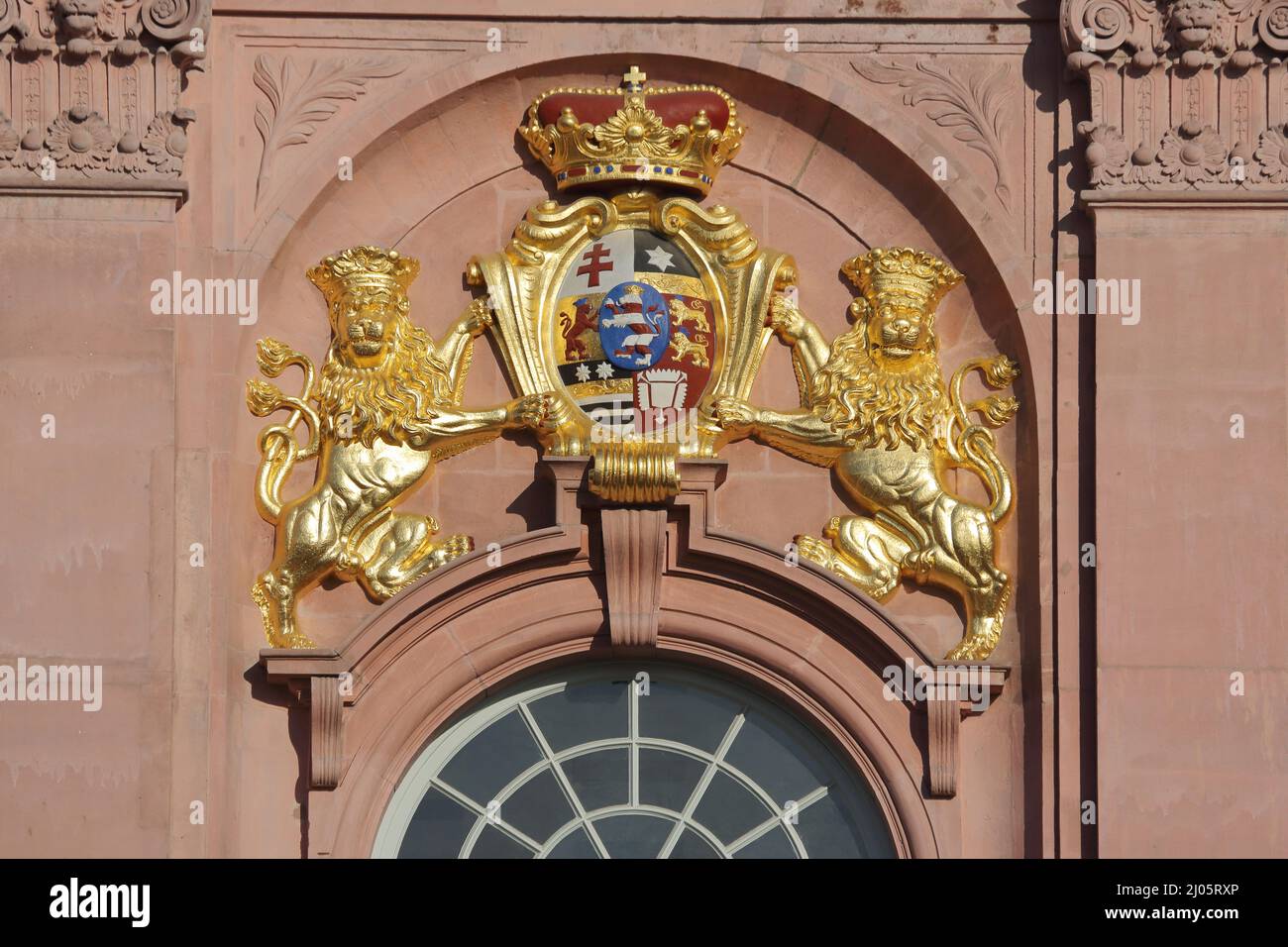 Golden coat of arms with two lions at the baroque residential palace in Darmstadt, Hesse, Germany Stock Photo