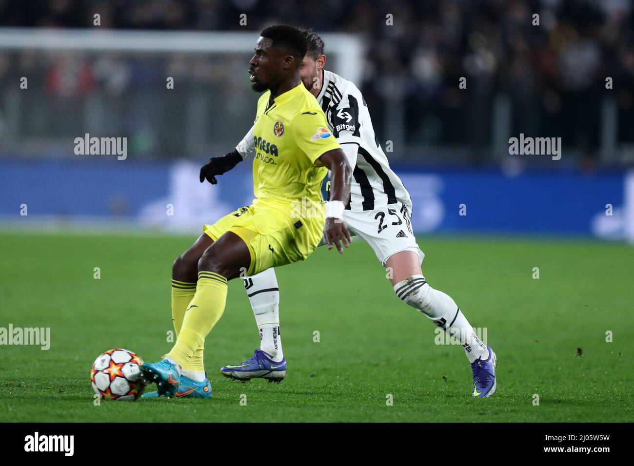 Torino, Italy. 16th Mar, 2022. Adrien Rabiot of Juventus Fc and Serge Aurier of Villarreal CF battle for the ball during the UEFA Champions League Round Of Sixteen Leg Two match between Juventus Fc and Villareal CF. Credit: Marco Canoniero/Alamy Live News Stock Photo