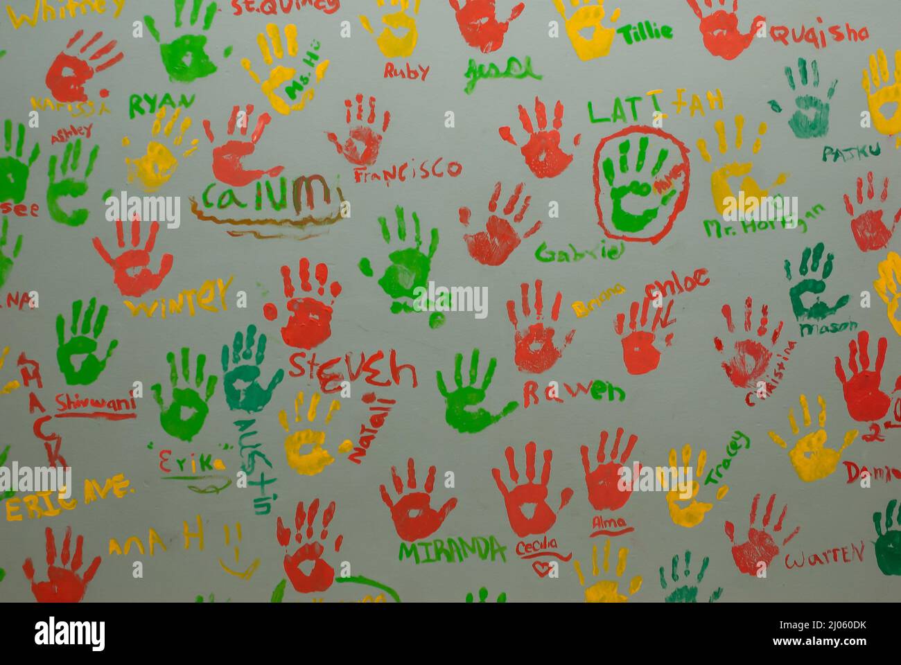 Children's Colorful Handprints on Wall Stock Photo