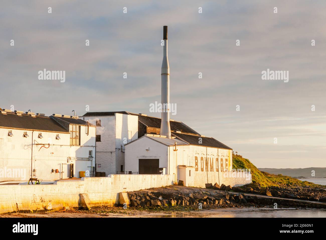 Bowmore Scottish whisky distillery in evening sunlight Islay Western Isles Scotland Stock Photo