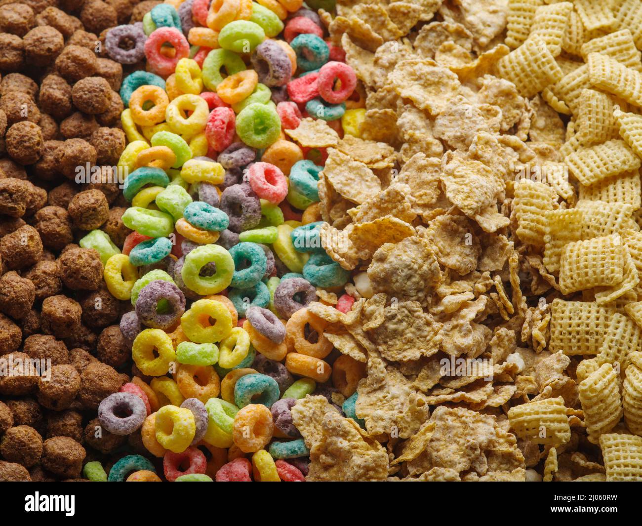 Various whole grain products, healthy snacks - chocolate balls, fruit rings, crunchy pads and cereals. Assorted whole grain quick breakfasts. Healthy Stock Photo
