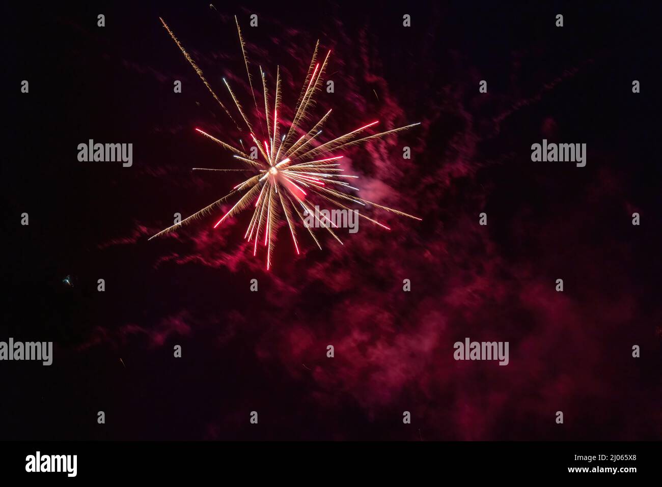 exploding bright red firework in dark night Stock Photo - Alamy