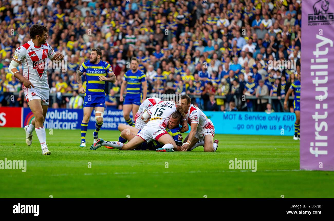 Warrington 16 July 2015: Warrington Wolves hosted St Helens at the Halliwell Jones Stadium. Ashton Sims is tackled in front of the posts Stock Photo