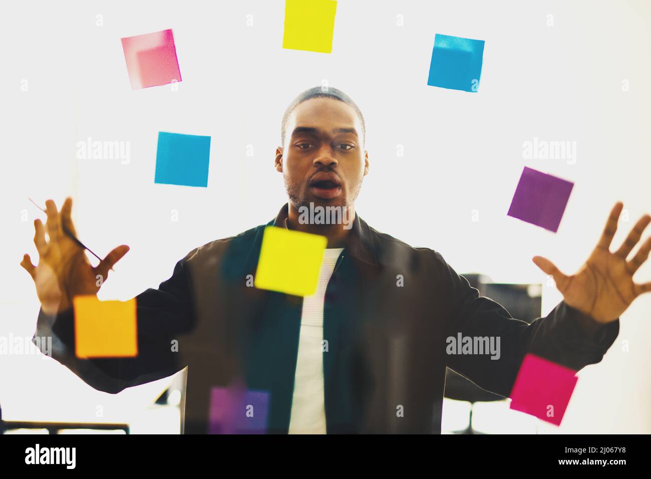 Stressed businessman due to overwork in office Stock Photo