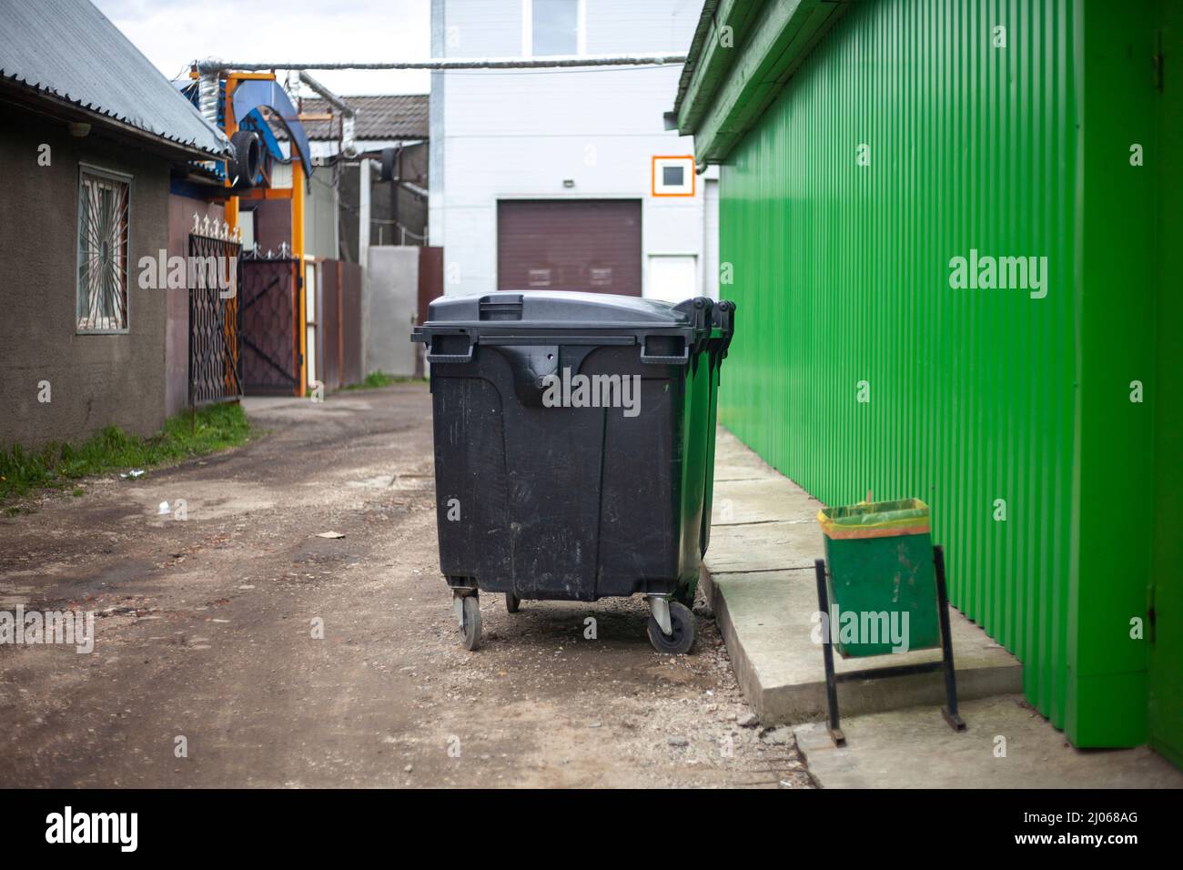 Garbage can. Garbage on street. Place of waste dumping from store