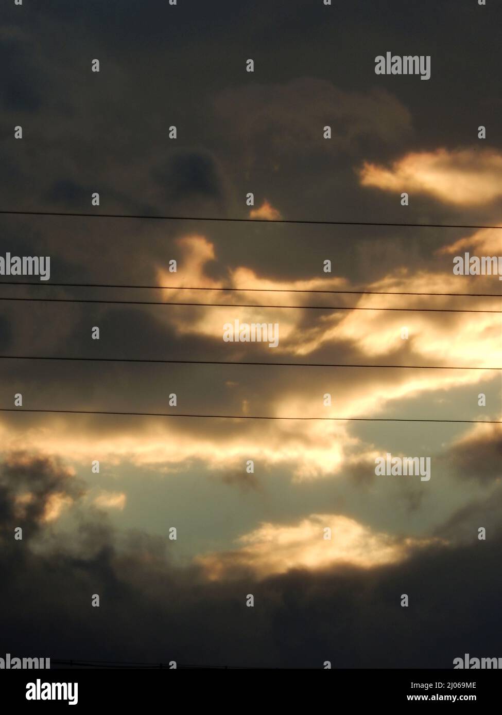 Power Lines and Cloudy Sunset Stock Photo - Alamy