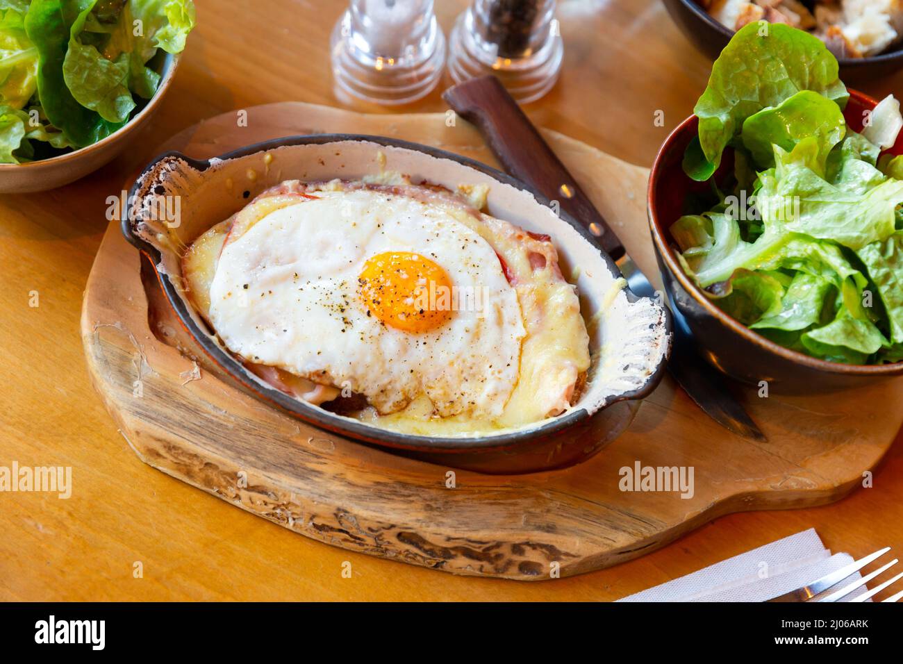 Original swiss cheese crust with fried eggs, cheese and bacon served