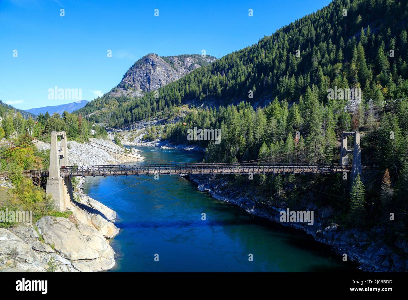 The Brilliant Suspension Bridge is a suspension bridge over the Kootenay River near Castlegar, British Columbia. The bridge was declared a national hi Stock Photo