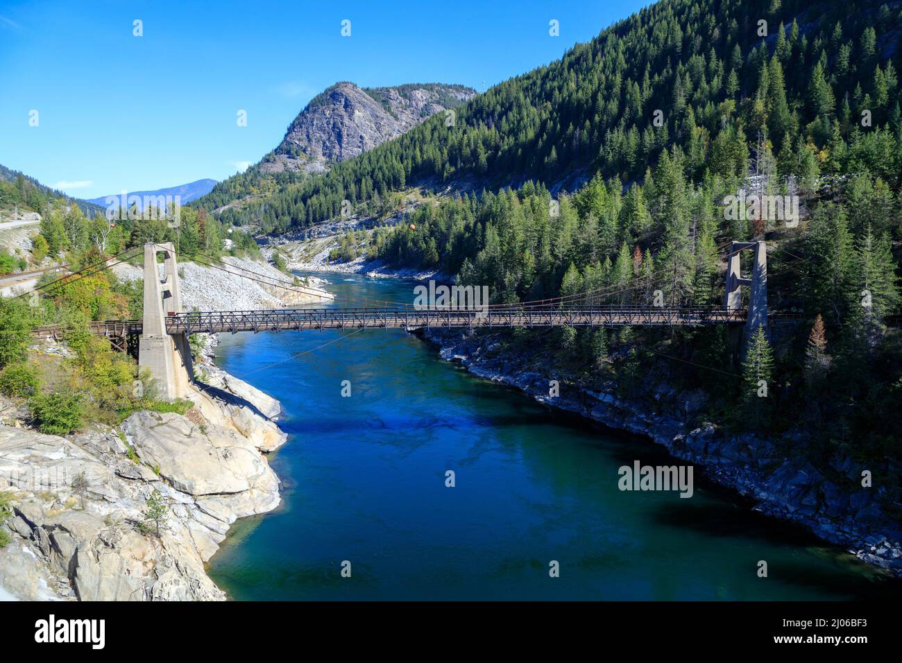 The Brilliant Suspension Bridge is a suspension bridge over the Kootenay River near Castlegar, British Columbia. The bridge was declared a national hi Stock Photo