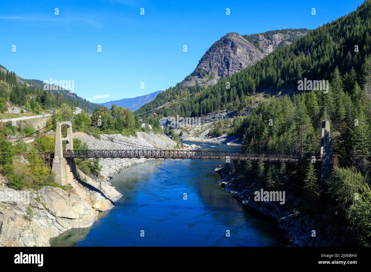 The Brilliant Suspension Bridge is a suspension bridge over the Kootenay River near Castlegar, British Columbia. The bridge was declared a national hi Stock Photo