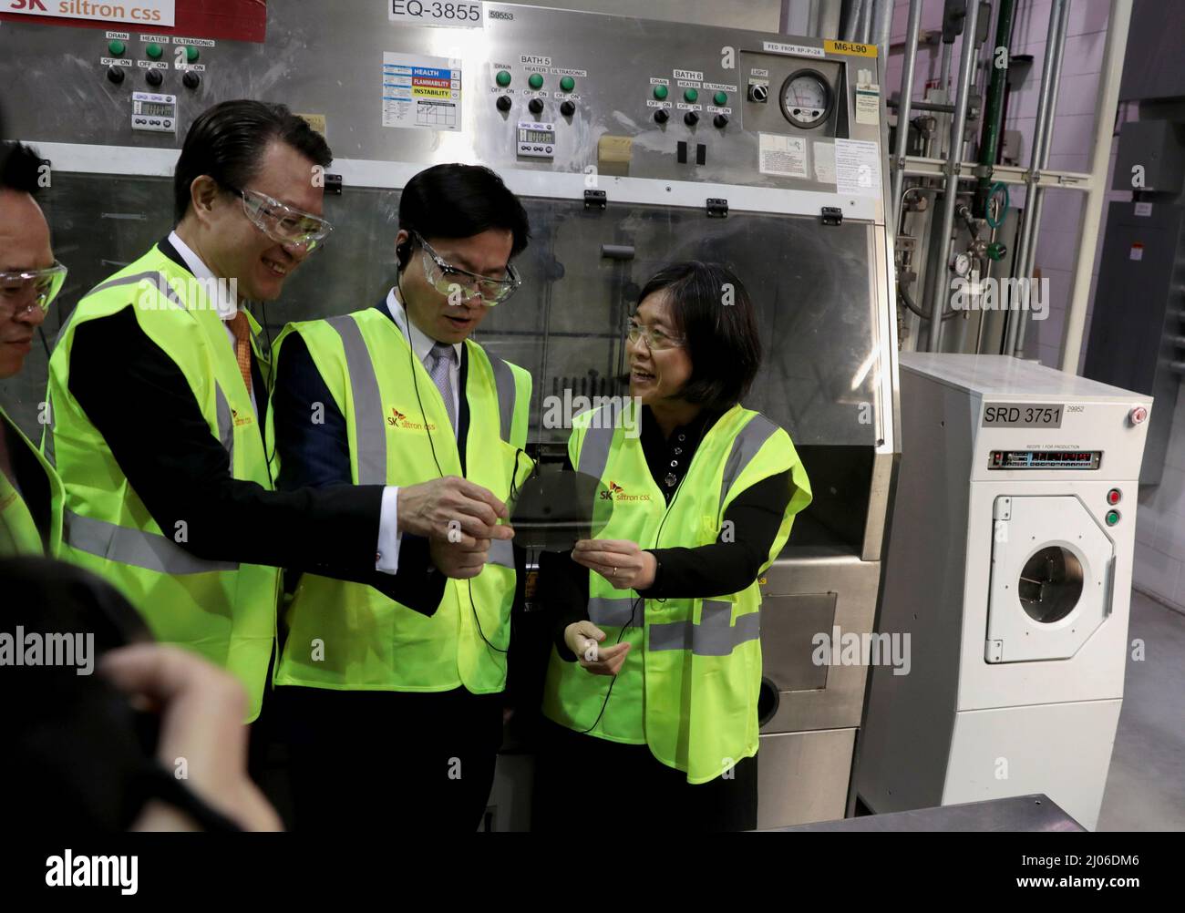 Ambassador Katherine Tai, U.S. Trade Representative, ROK Trade Minister Yeo Han-Koo, and Jeong Joon You, vice chairman SK Group tour a silicon wafer plant being expanded by South Korean semiconductor manufacturer SK Siltron CSS in Auburn, Michigan, U.S., March 16, 2022. REUTERS/Rebecca Cook Stock Photo