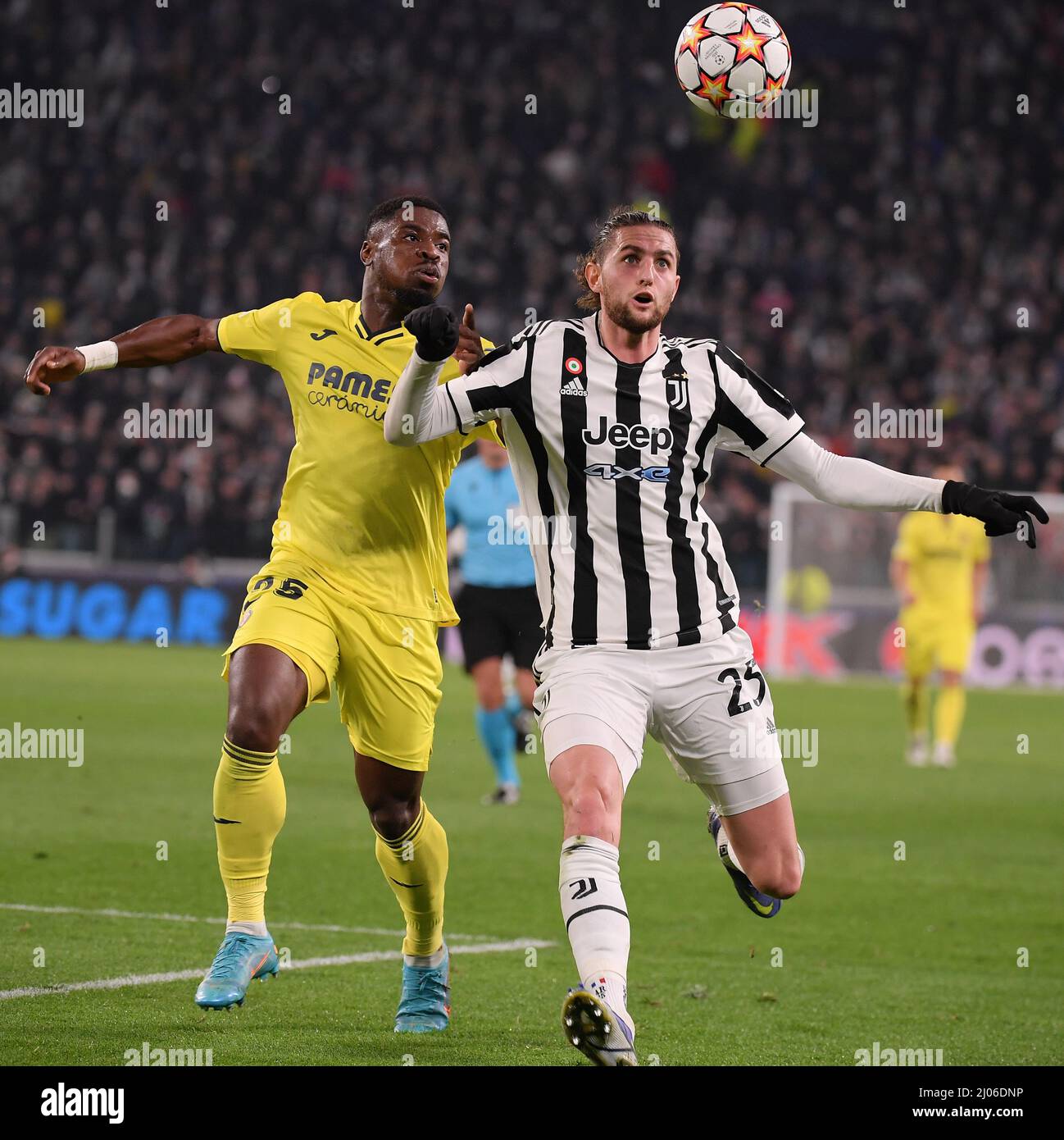 Turin, Italy. 16th Mar, 2022. Juventus' Adrien Rabiot (R) vies with Villarreal's Serge Aurier during the UEFA Champions League round of 16 second leg match between FC Juventus and Villarreal in Turin, Italy, March 16, 2022. Credit: Federico Tardito/Xinhua/Alamy Live News Stock Photo