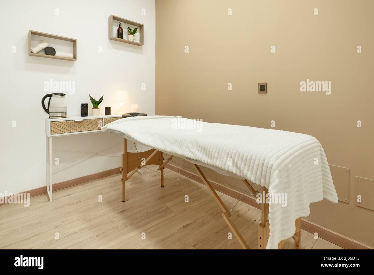 Folding wooden stretcher table inside a massage cabin Stock Photo Alamy