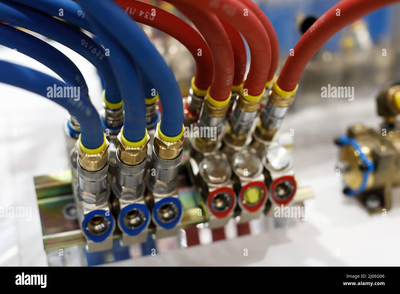 Reinforced rubber air hoses with pneumatic fittings. Selective focus. Stock Photo