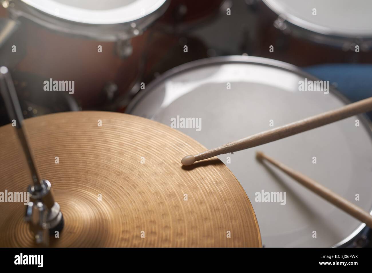 Making musical magic. Shot of a drum kit sitting in a music studio. Stock Photo