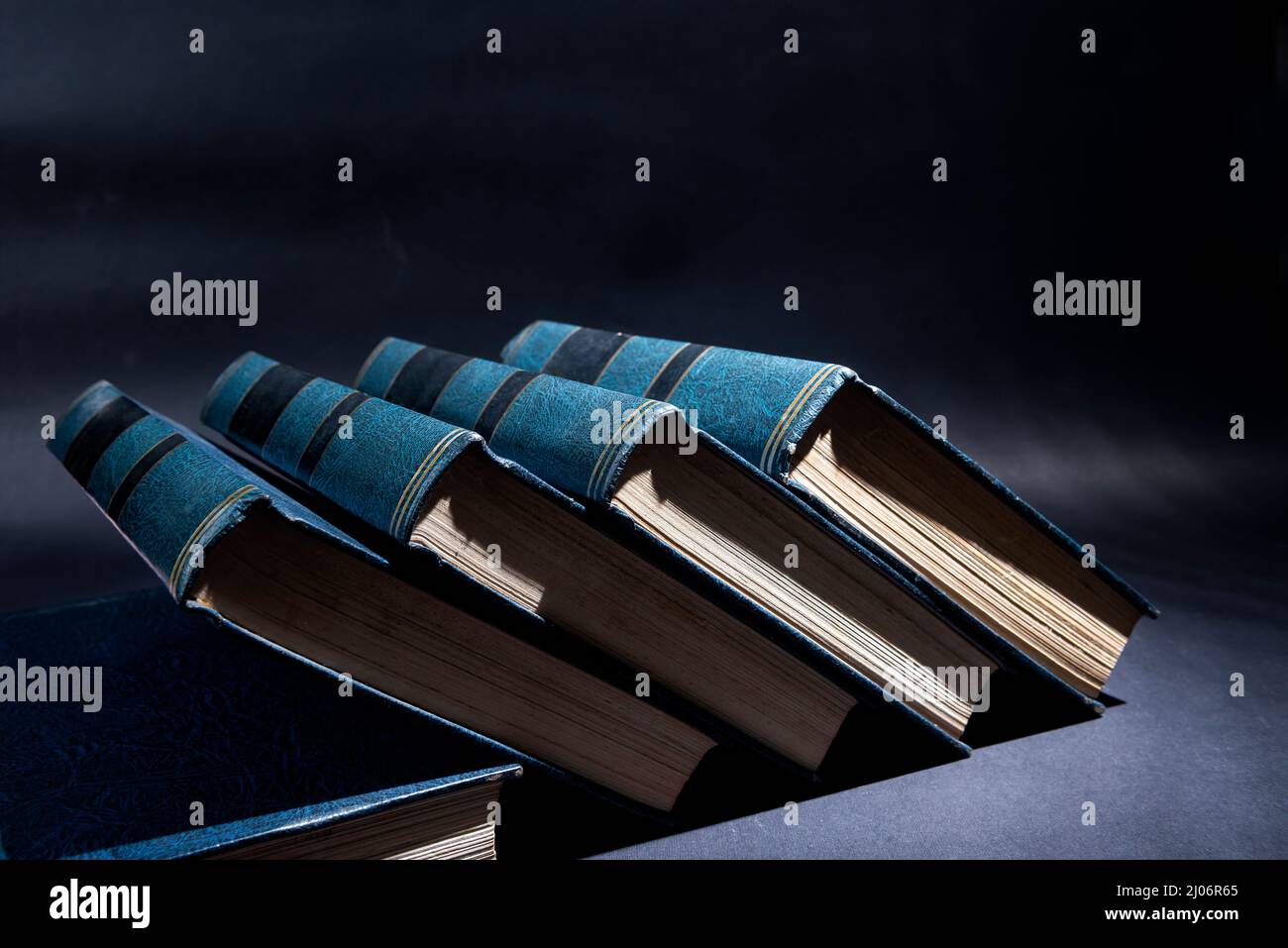 Stack of books with dark background Stock Photo - Alamy