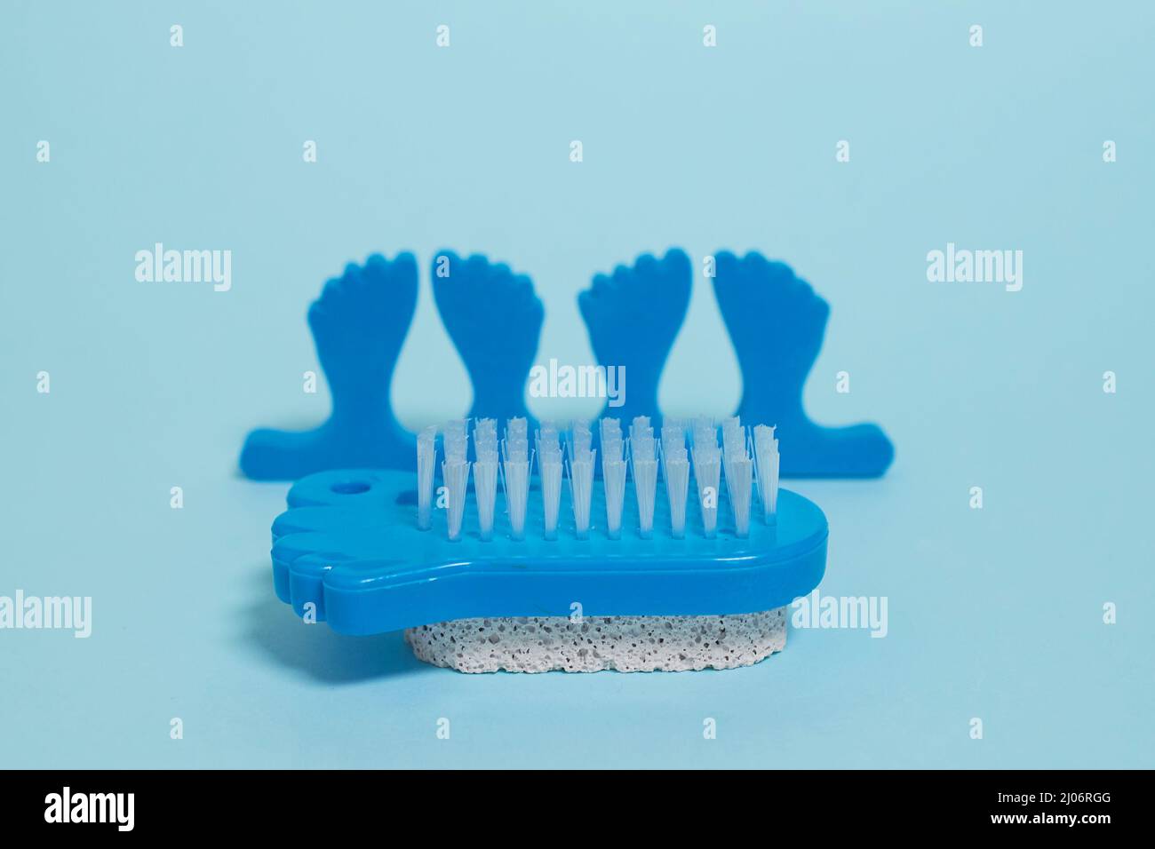 Pedicure kit. Finger separators, pumice stone and foot brush Stock