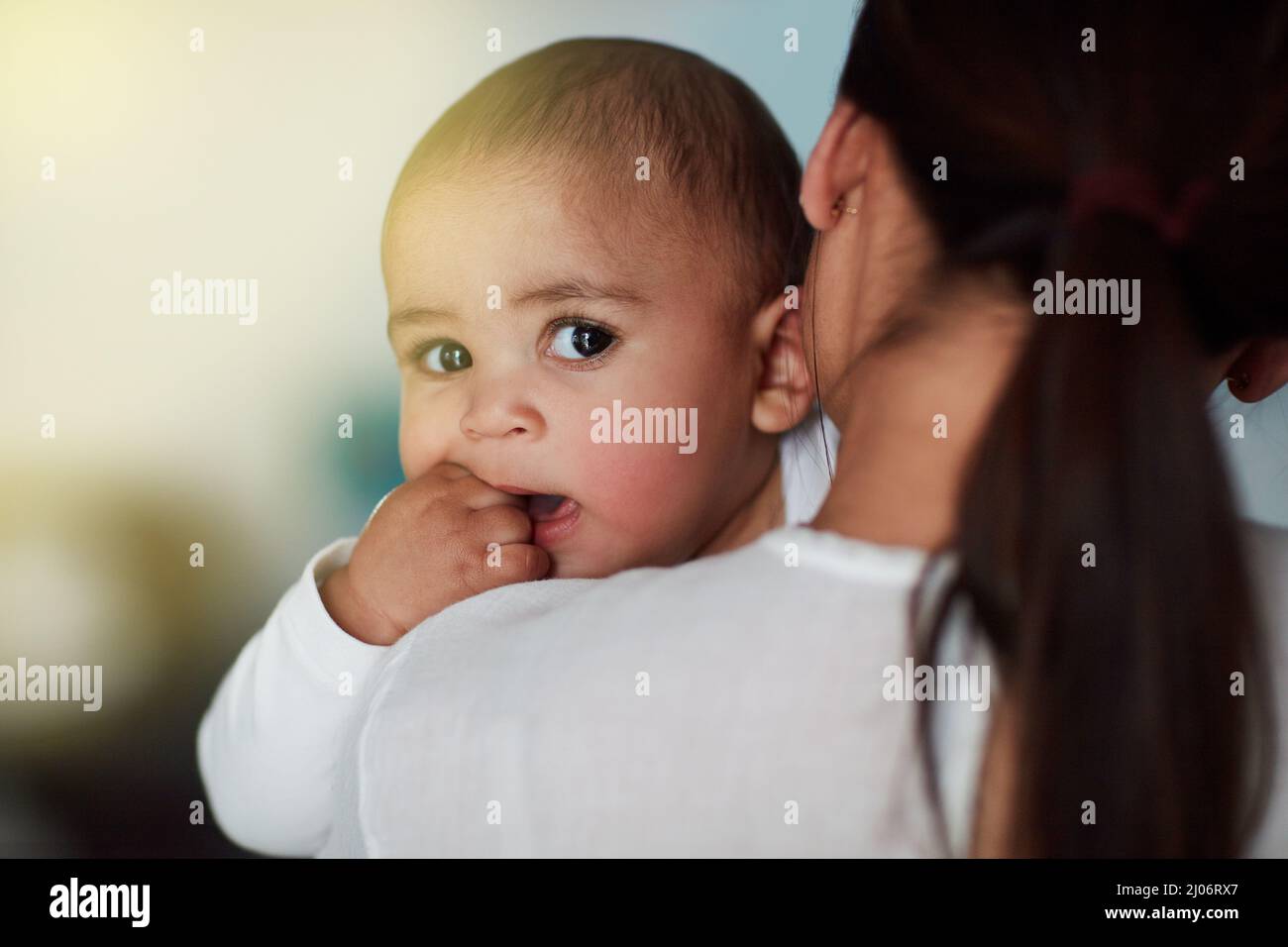 Hold my calls until Im done bonding with Mom. Shot of a loving mother carrying her baby boy at home. Stock Photo