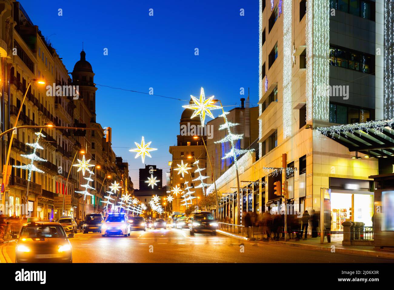 Christmas decorations on the streets in Barcelona in the evening, Catalonia, Spain Stock Photo