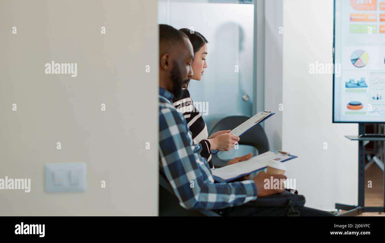 HR worker inviting female applicant to attend job interview in office