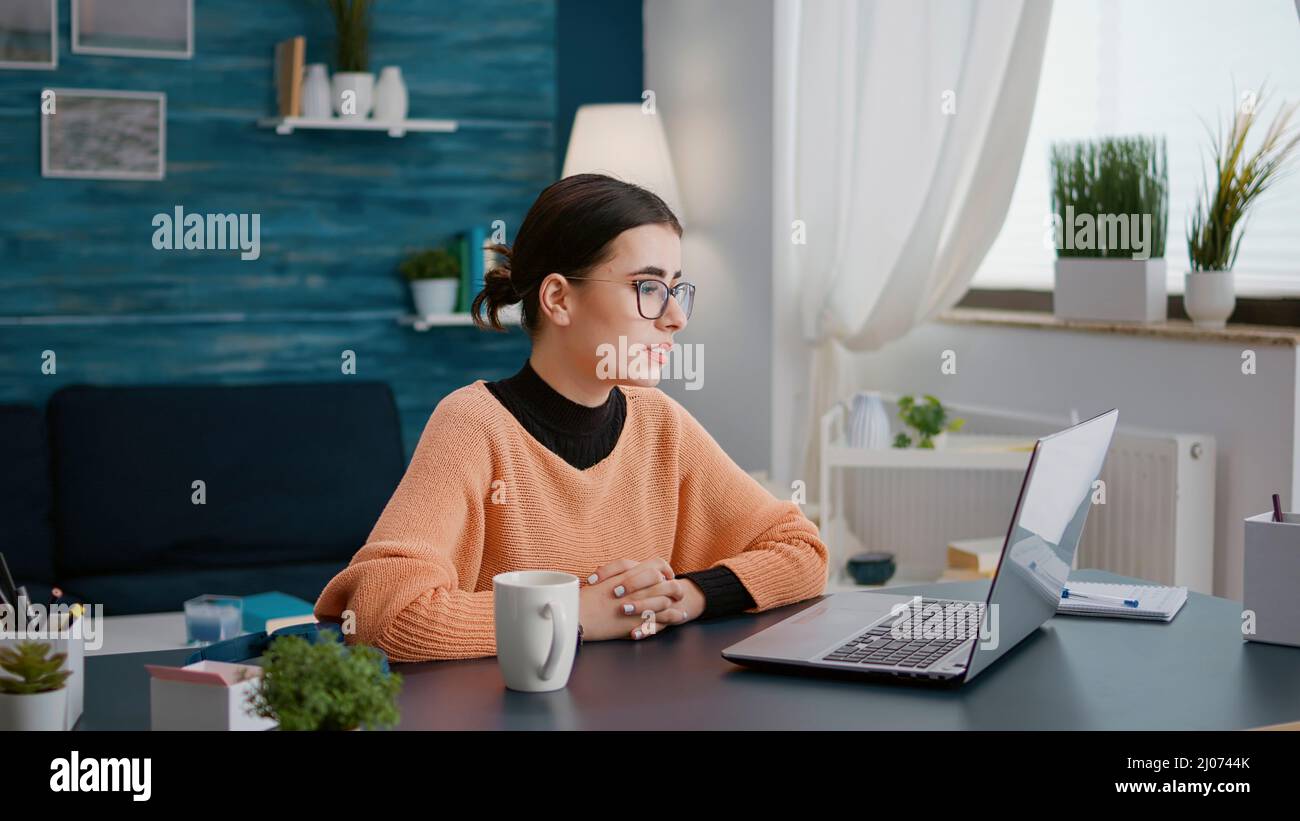 Video Call Lesson Woman attending remote video call lesson on laptop, using ...
