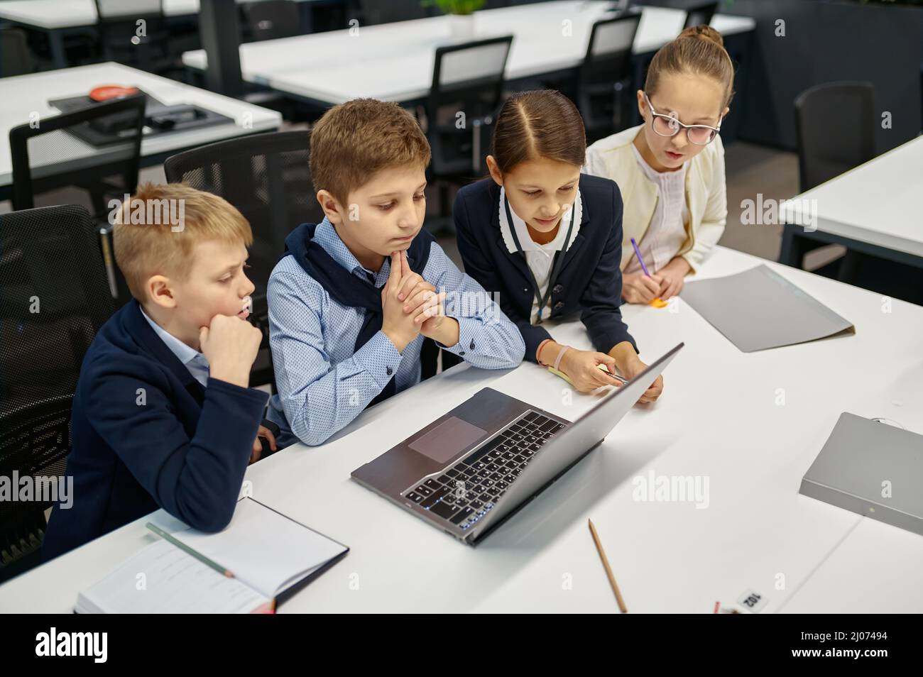 Digital native students e-learning over laptop computer Stock Photo - Alamy
