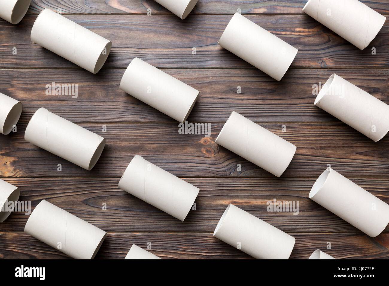 Empty toilet paper roll on colored background. Recyclable paper tube