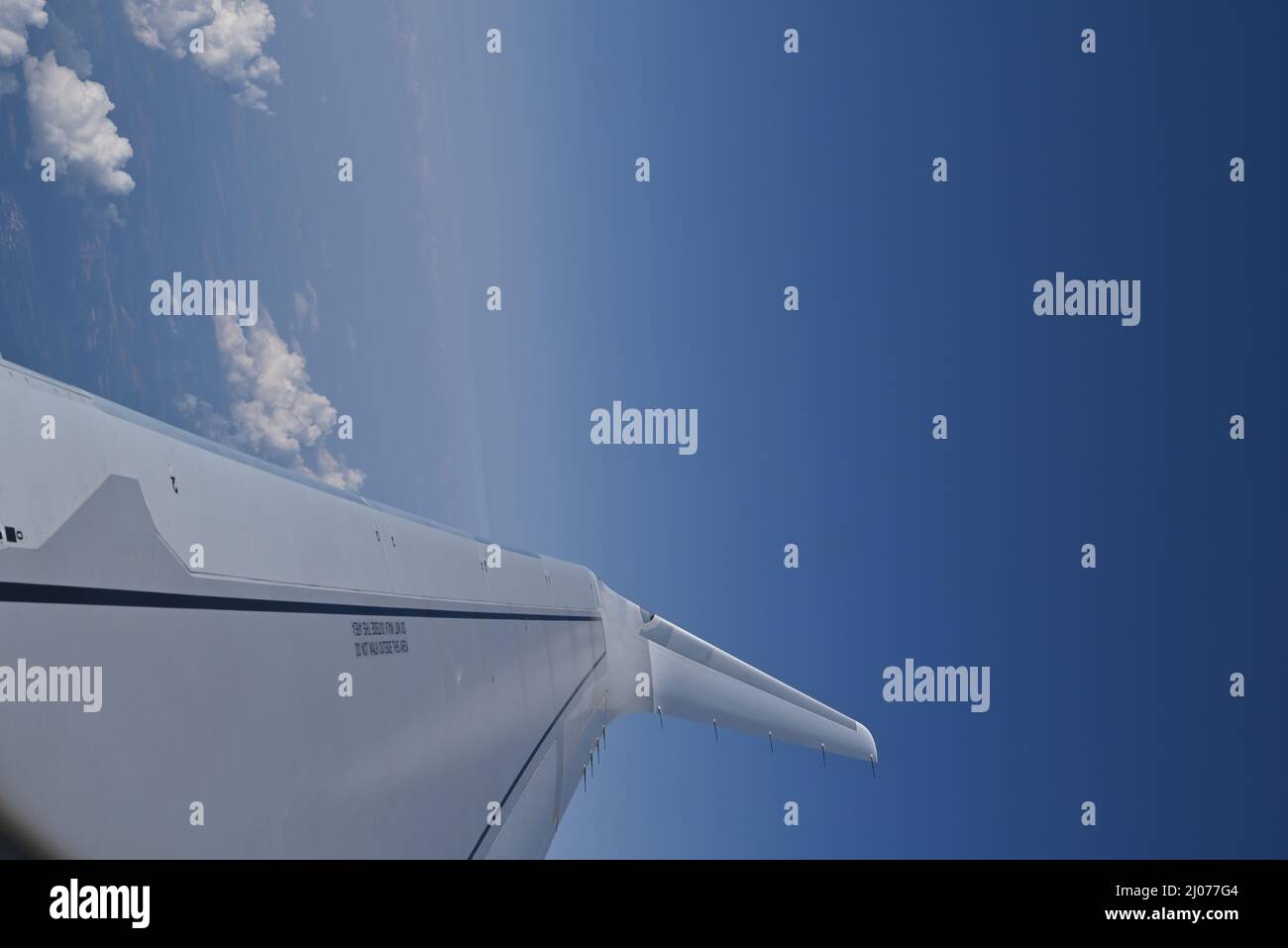 Photo of an airplane wing from a window Stock Photo - Alamy