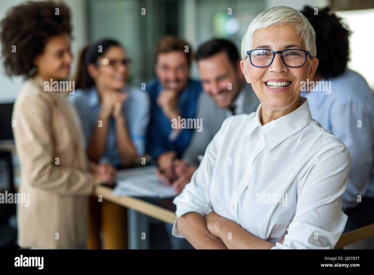 Mature business woman standing hi-res stock photography and images - Alamy