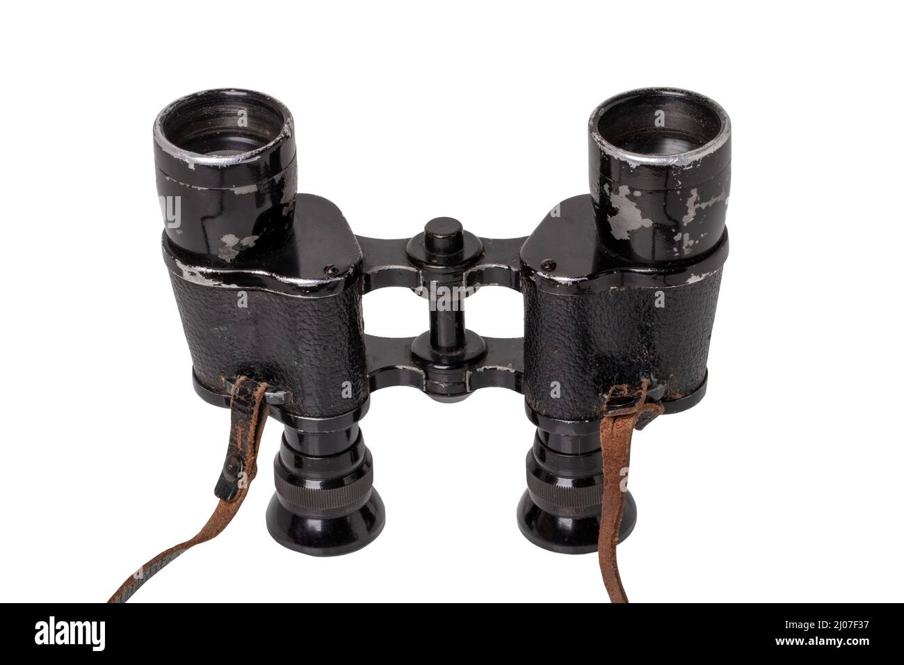 Vintage binoculars isolated. Closeup of an old german Binoculars with leather straps used from