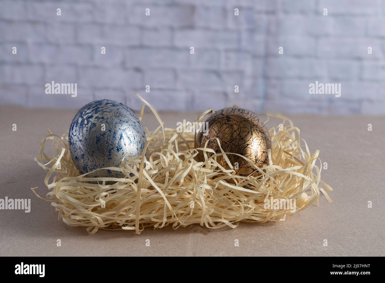 Decorated and painted easter eggs in straw nest Stock Photo - Alamy