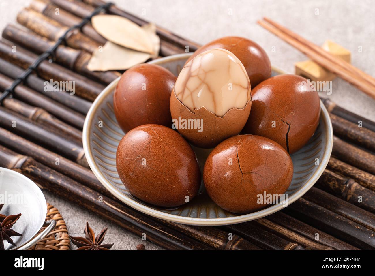Close up of delicious traditional Taiwanese famous food tea eggs with in a bowl on gray table background. Stock Photo