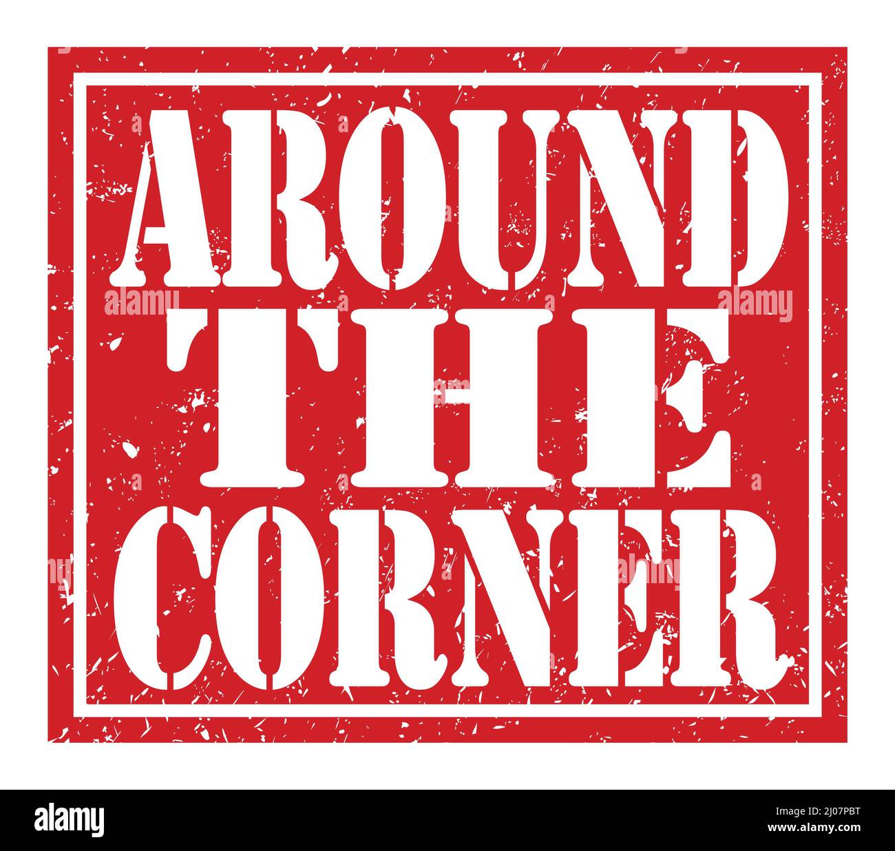AROUND THE CORNER, words written on red stamp sign Stock Photo Alamy
