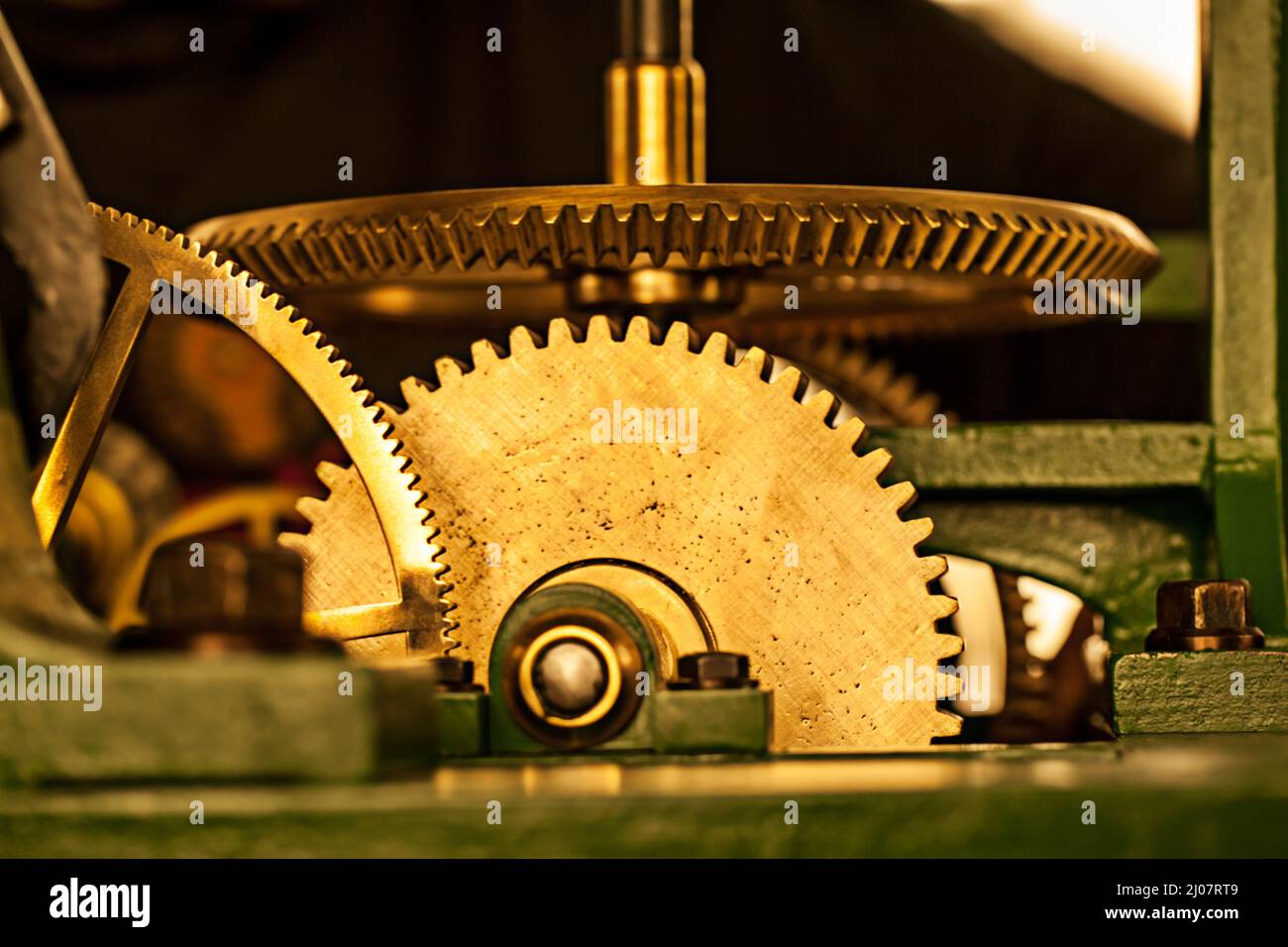 Timeless heritage. Shiny toothed gears of a large clock. Stock Photo
