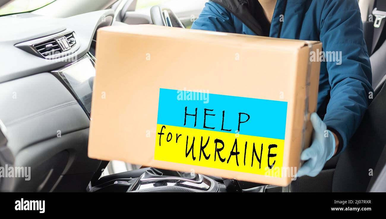 Box with donation clothes for ukrainian refugees suffering from war