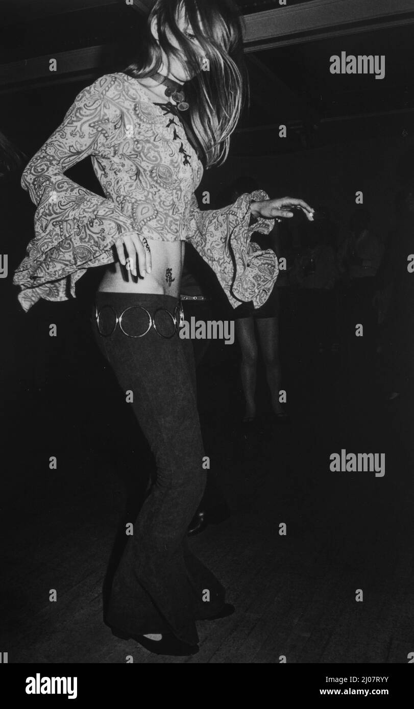 Pretty girl dancing in nightclub . Stock Photo