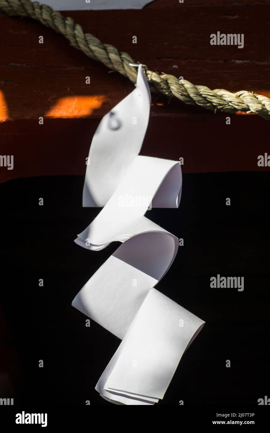 Close up detail of Japanese paper zigzag Shide streamer hanging