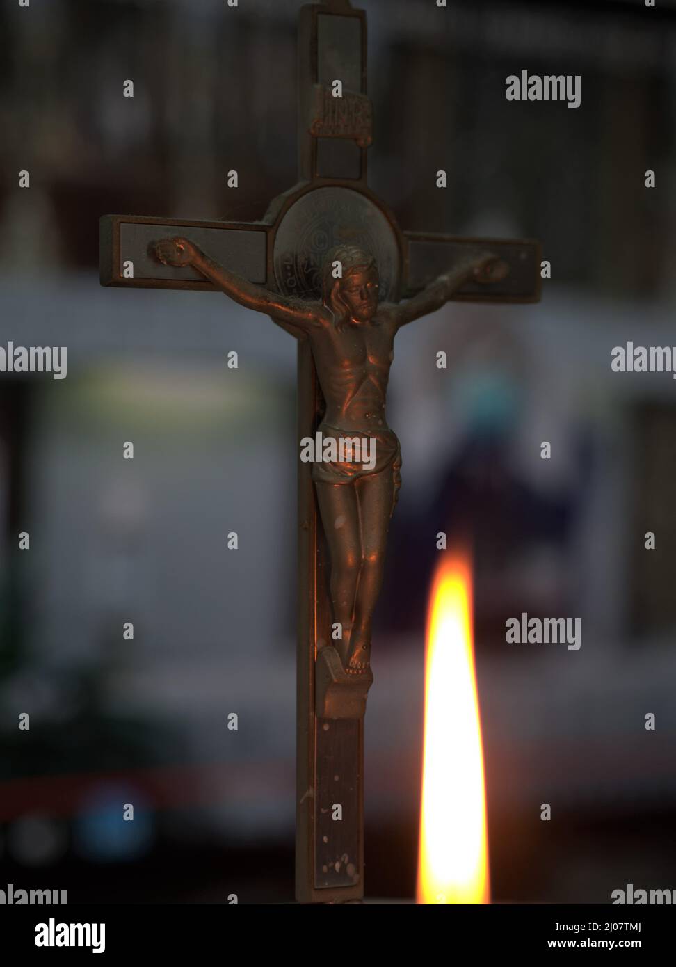 Cross Crucifix Benedict on Online Mass Salib Benedict dengan Latar Belakang Misa Online Stock Photo