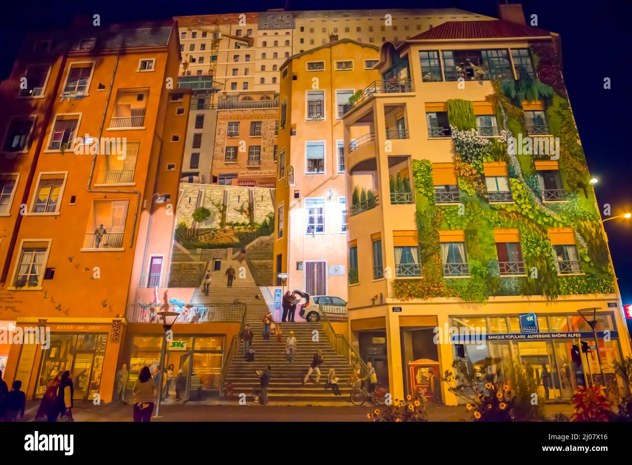 Painted Facade Wall on a Building in Lyon at Night in AuvergneRhoneAlpes, France. *** Local