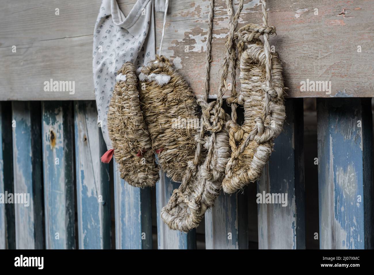 Traditional Japanese waraji or tie-on woven sandals made of rice straw hanging in a temple in Kyoto, Japan Stock Photo