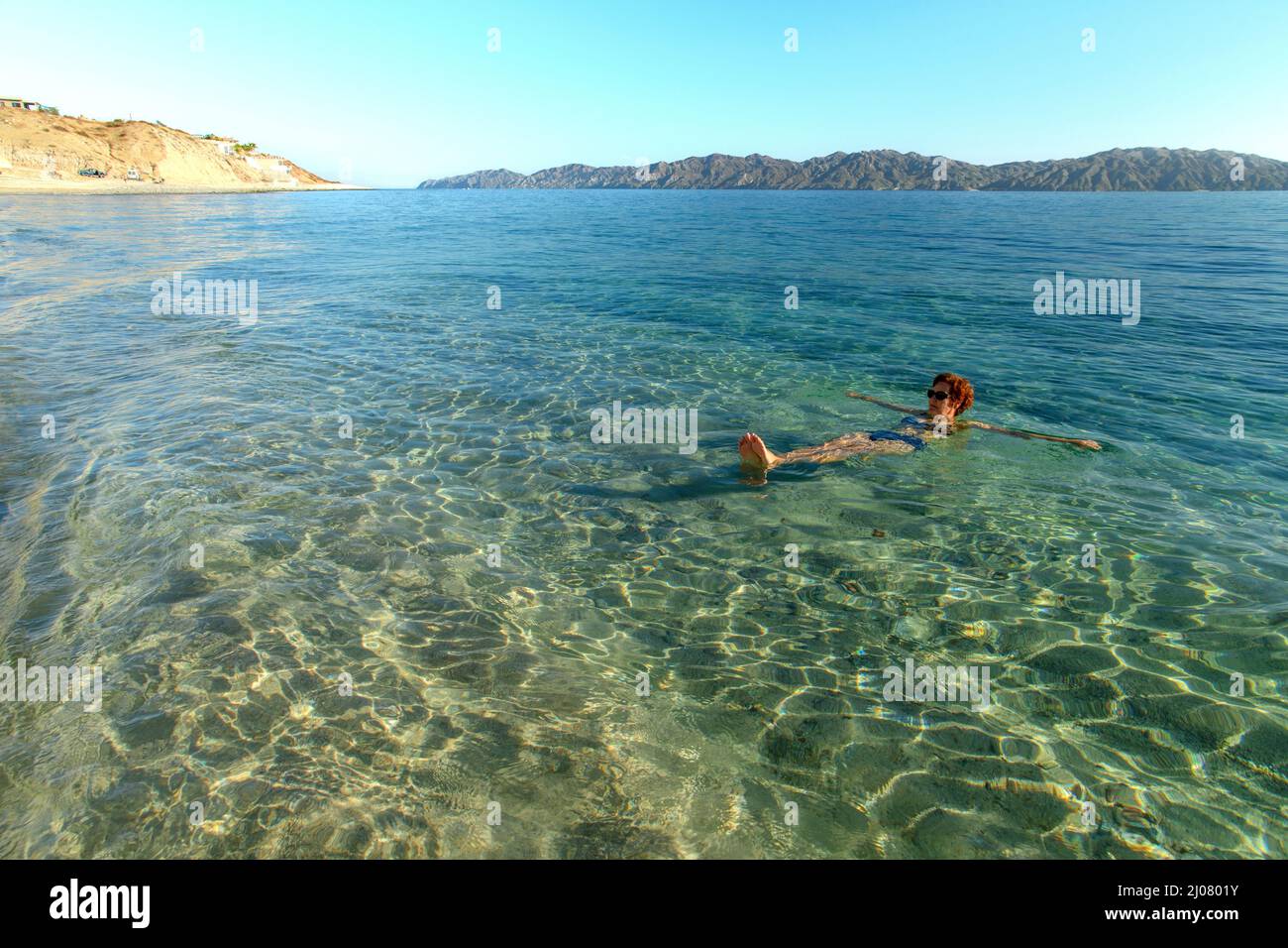 Mexico,  Baja California Sur, El. Sargento, hot water beach, woman swimming MR Stock Photo