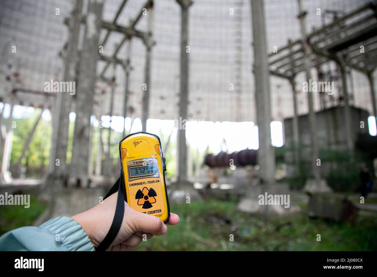 A handheld Geiger counter showing the magnitude of the radiation inside the water-cooling tower of the Chernobyl nuclear power plant. The situation of the Chernobyl nuclear plant remains at high risk according to the Ukrainian government since the Russian Force captured the area. The Russian Force repeatedly halt the energy supply to the nuclear plant which was used to cool down the core of the destroyed number 4 nuclear plant. However, the International Atomic Energy Agency (IAEA) ensured the public on last week statement that there was no need for immediate alarm over the condition of the de Stock Photo