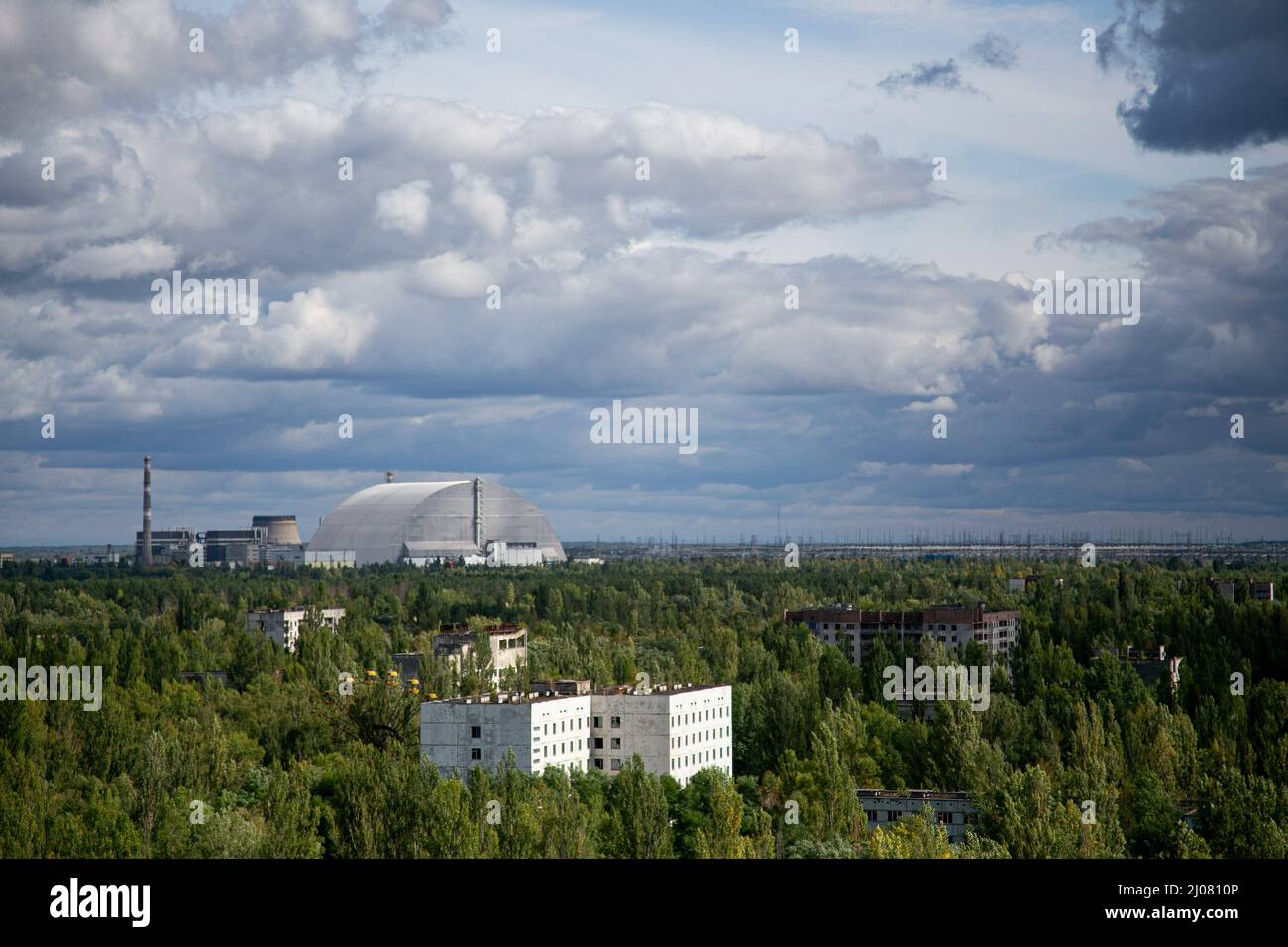 Pripyat, Ukraine. 4th Sep, 2019. A distance view of the arch-shaped New Safe Confinement structure installed in 2016 to contain the remains of Chernobyl's number 4 reactor unit which was destroyed during the historical Chernobyl nuclear disaster in 1986 due to the meltdown and explosion of the nuclear reactor. The situation of the Chernobyl nuclear plant remains at high risk according to the Ukrainian government since the Russian Force captured the area. The Russian Force repeatedly halt the energy supply to the nuclear plant which was used to cool down the core of the destroyed number 4 n Stock Photo