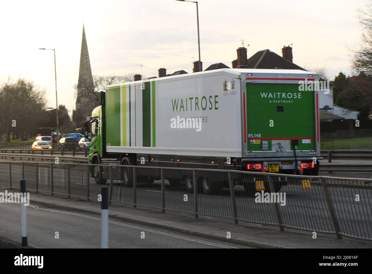 Waitrose articulated lorry driving along the road heading out of Southampton along the A35. Stock Photo