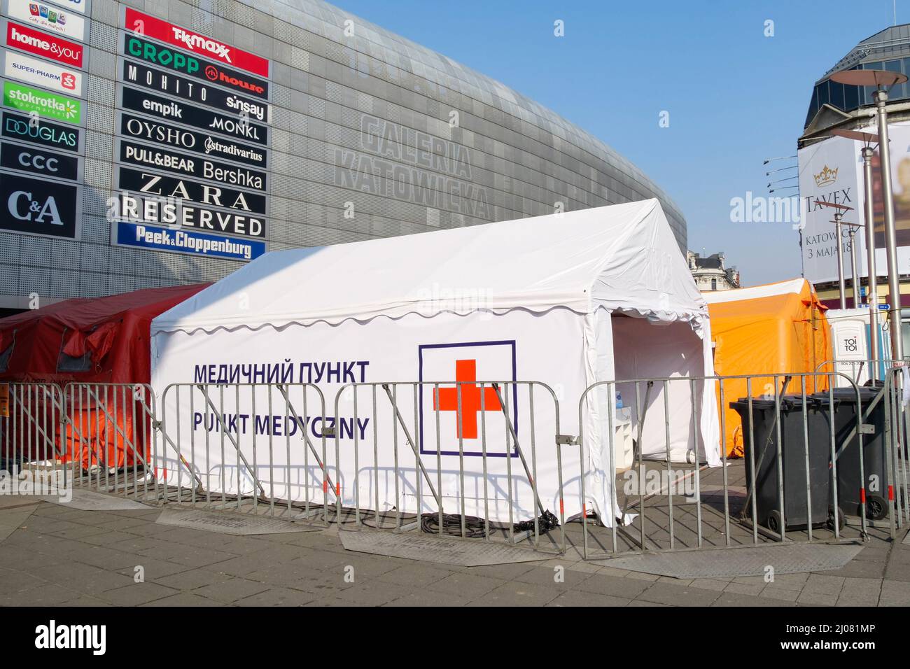 Ukrainian refugee help center in the city. Volunteers are giving out clothes, food, and other donations. Help for million of war refugees Stock Photo