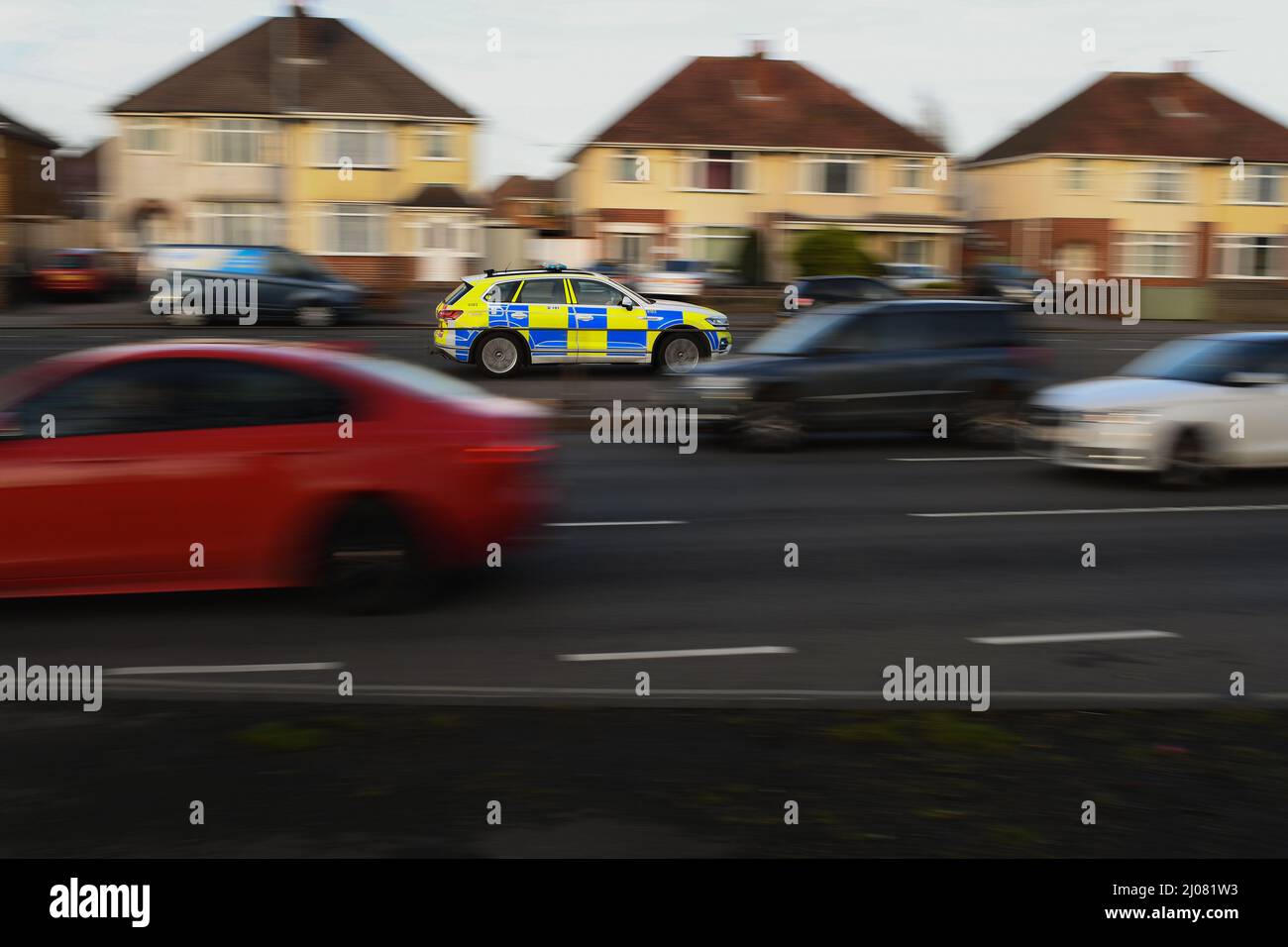 Hampshire police car SUV VW Tiguan driving along the road panned with movement on the way to an emergency call with blue lights with copy space. Stock Photo