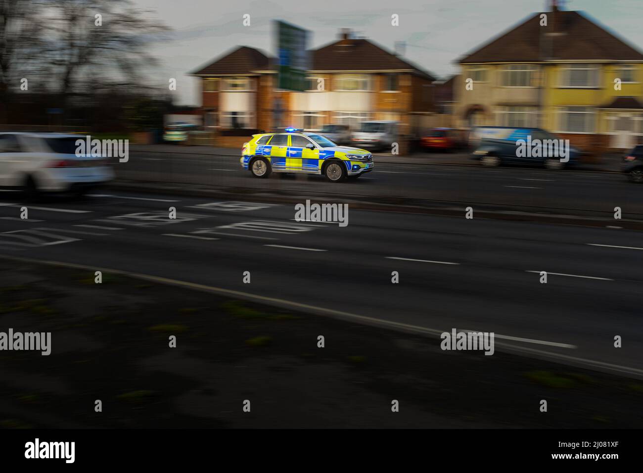 Hampshire police car SUV VW Tiguan driving along the road panned with movement on the way to an emergency call with blue lights with copy space. Stock Photo