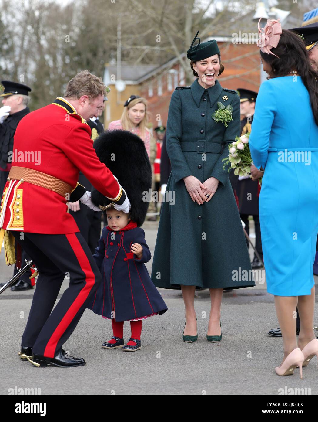 The Duchess of Cambridge laughs as Lieutenant Colonel Rob Money puts a ...
