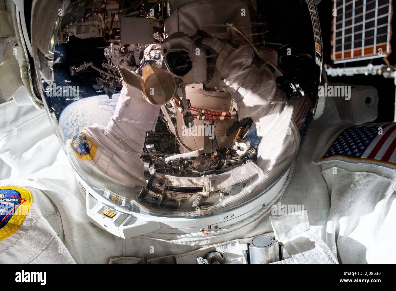 International Space Station, Earth Orbit. 15th Mar, 2022. International Space Station, EARTH ORBIT. 15 March, 2022. NASA astronaut Kayla Barron, takes a selfie, reflected by her helmet visor during a nearly 7 hour long spacewalk to prepare the International Space Station for the next roll-out solar array, March 15, 2022 in Earth Orbit. Credit: NASA/NASA/Alamy Live News Stock Photo