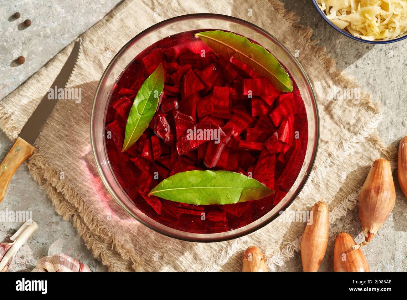 Preparation of fermented red beet kvass with onion, garlic and bay leaf